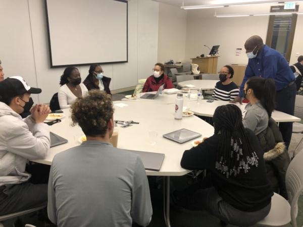 Students in the COVID and mental health subgroup discussing their project with the community partners and Jean-Marie Kouassi.